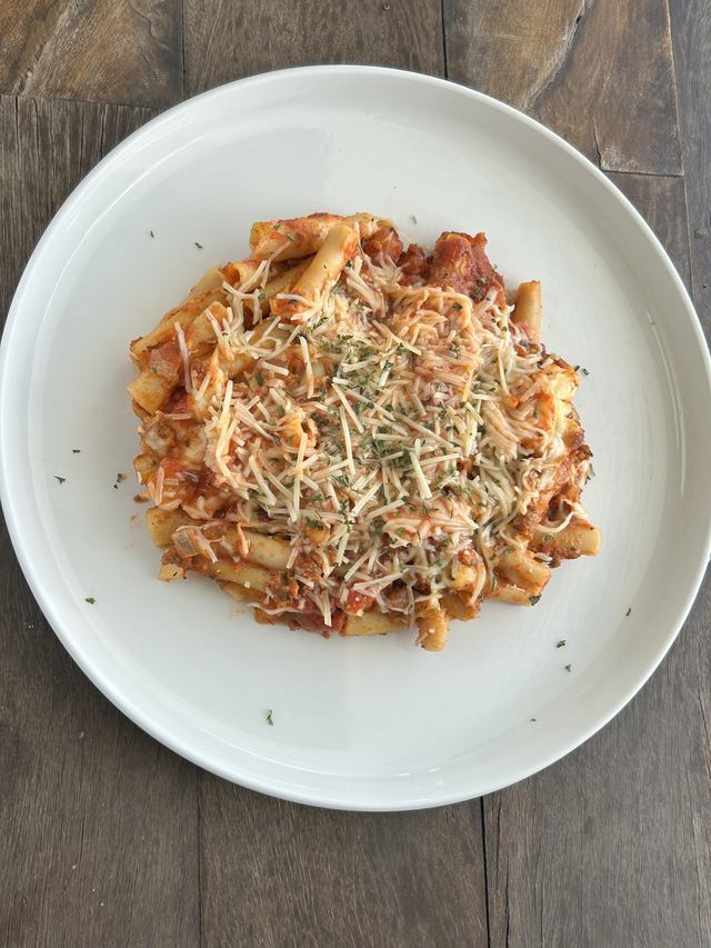 Baked ziti with meat sauce and melted cheese