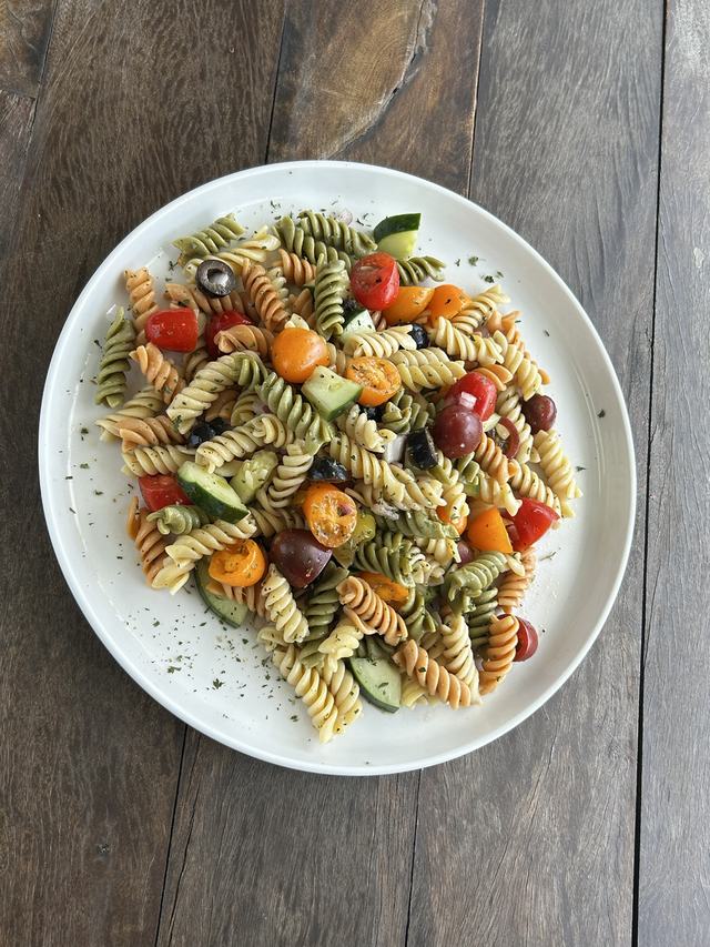 Garden pasta salad with rotini, tomatoes, cucumber and olives